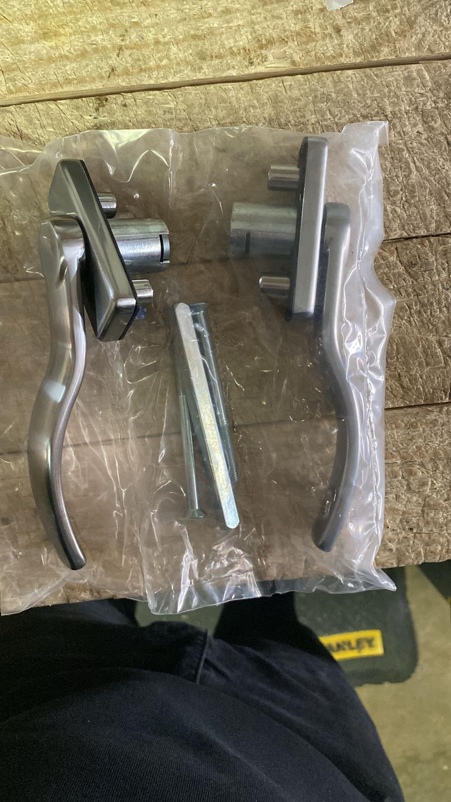 New door handle hardware ready for fitting